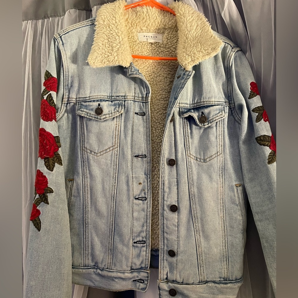 Denim jean jacket with Sherpa interior and roses on the sleeves